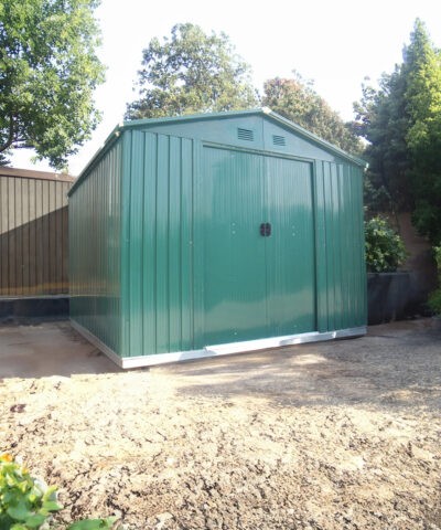 The Green Colossus Shed in a garden