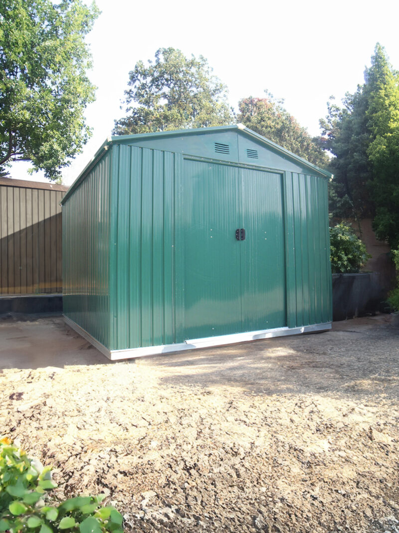 The Green Colossus Shed in a garden