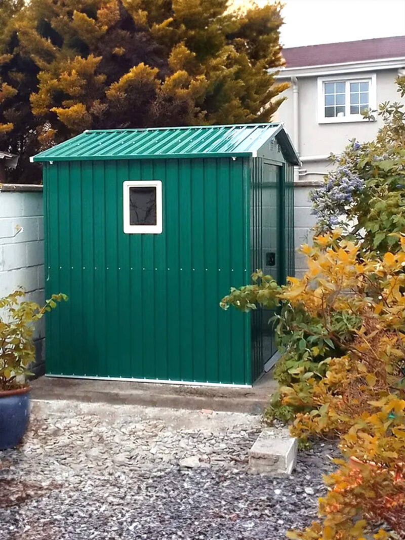 The side of the 8f x 6ft with a window in a small garden