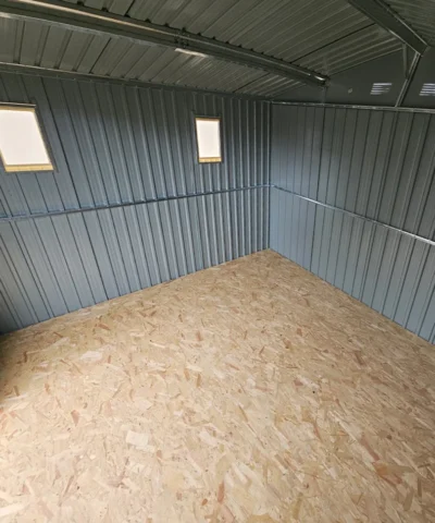 An interior view of the 9ft x 10ft showing two installed windows on the side wall