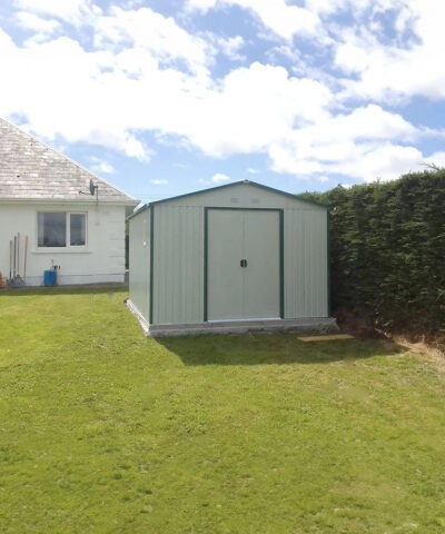 the off-white colossus shed in an enclosed garden