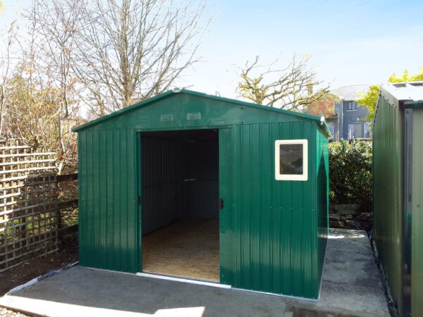 The Colossus Shed in a customers garden as seen from the front with both doors open.