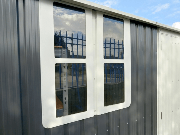 The polycarbonate window on the steel cottage shed