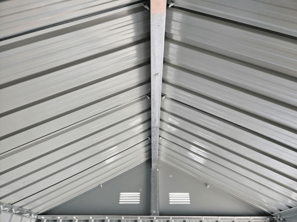 a view of the steel sheets that form the roof as seen from inside the shed