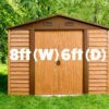 8ft x 6ft Woodgrain metal shed sitting in a lovely garden