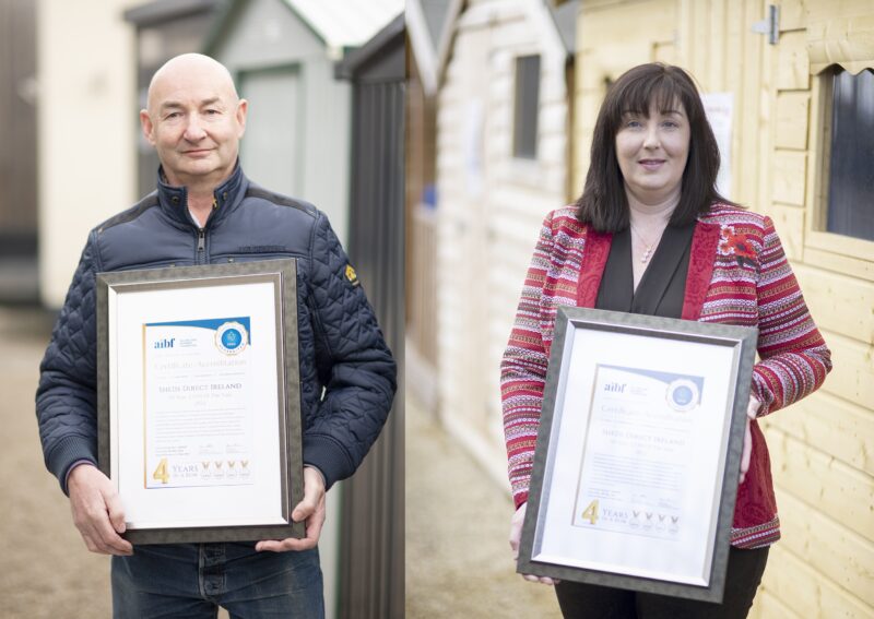 Alan and Louise from Sheds Direct Ireland holding the '.com of the year 2022' award from the Business All stars, AIBF