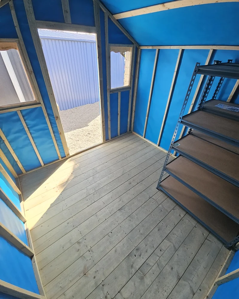Inside the wooden overhang shed