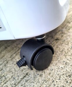 A look at plastic wheels on the bottom of the air cooler. They are a hard plastic and have hard, black stoppers on them