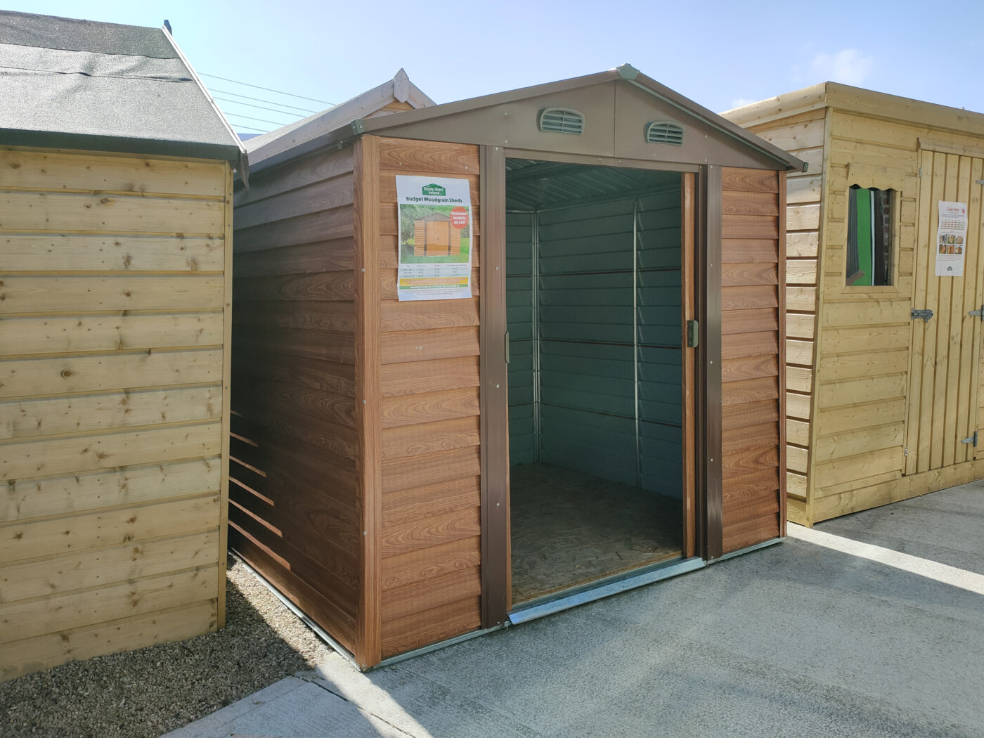 A woodgrain metal shed in sheds direct Ireland's yard