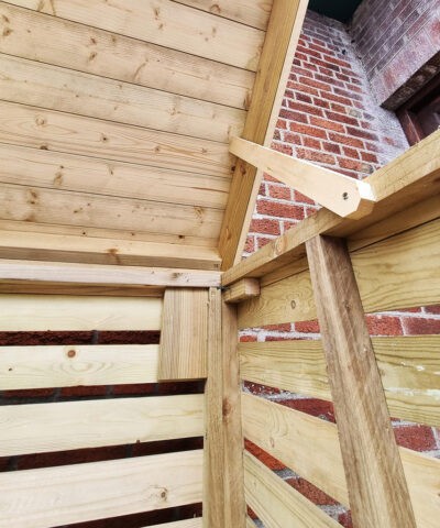 The inside hinge on the wooden bin store
