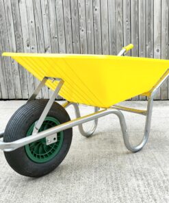 The yellow 90l plastic wheelbarrow against a wooden wall