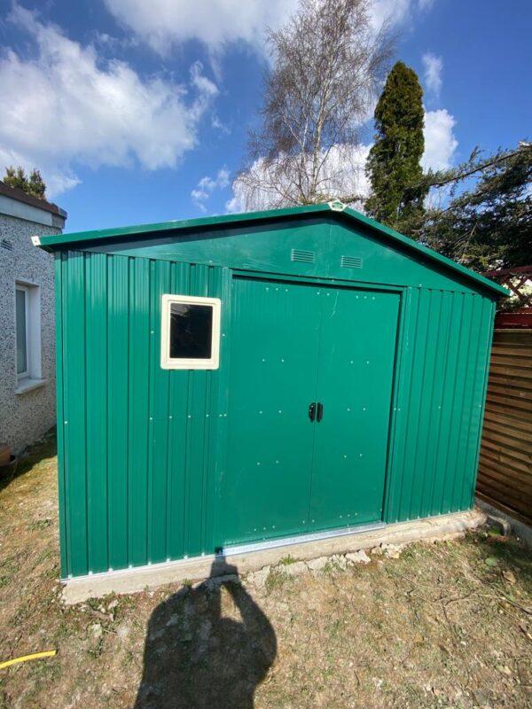 a window kit installed on the front of a shed