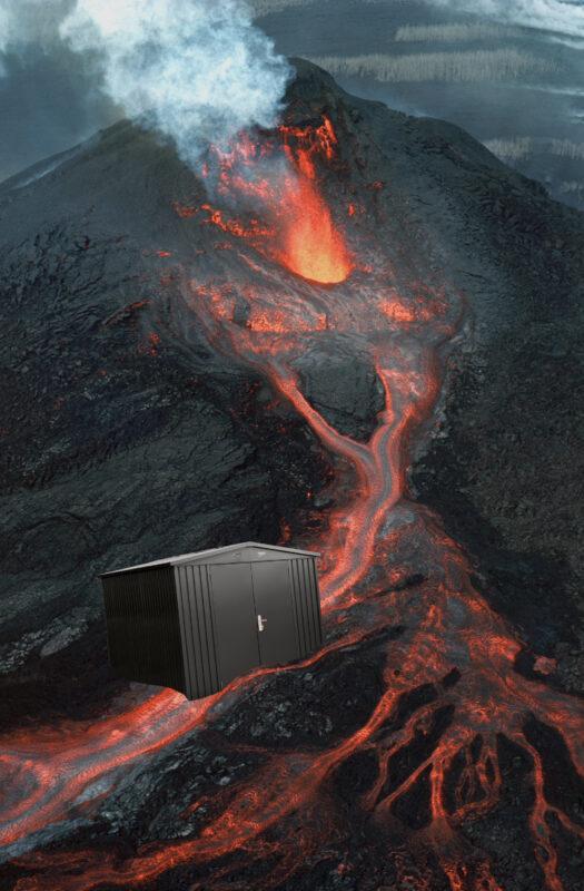 A shed photoshopped into the flow of lava from an active volcano