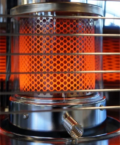 The wick inside the globe glowing orange with heat