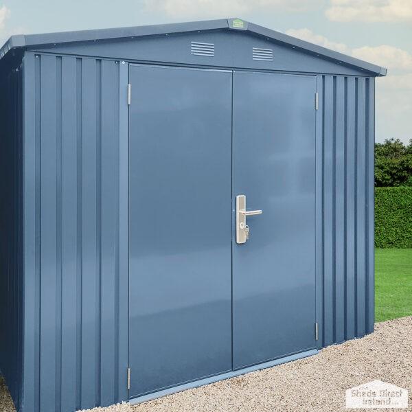 Another angle of the big blu shed sitting in a garden