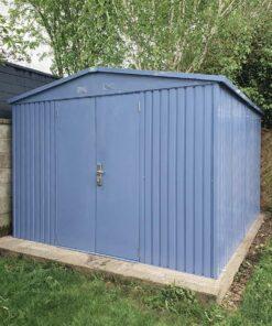 The Big Blue shed in the corner of a garden
