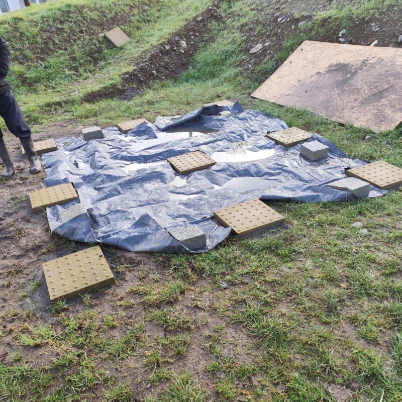 9 blocks of tactile paving on a sheet of plastic