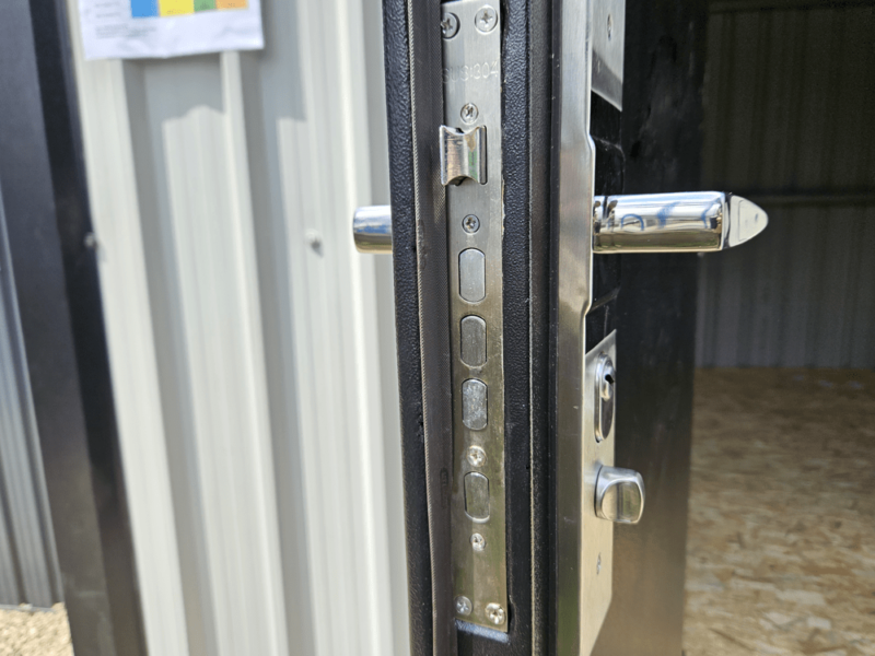 The handle, locking mechanism and bolts on the door of the Heavy Duty Shed