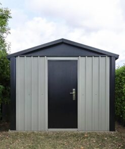 The off-white and black heavy duty shed in a garden.