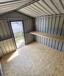 An inside view of the heavy duty shed, looking outwards towards the door