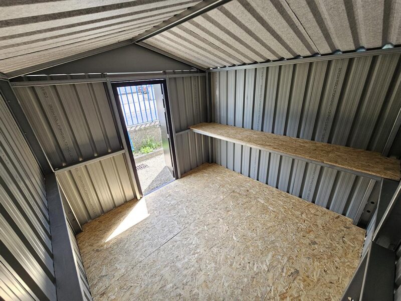 An inside view of the heavy duty shed, looking outwards towards the door