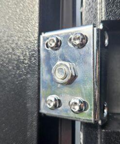 A close up, detailed view of the hinge on the door