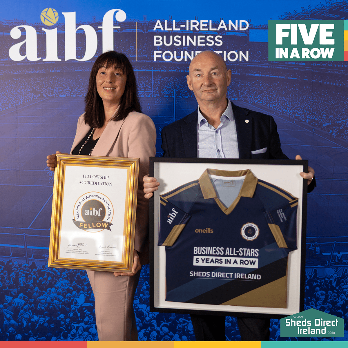 Louise and Alan from Sheds Direct holding their awards for 5 years in a row with the AIBF in Croke Park, 2023