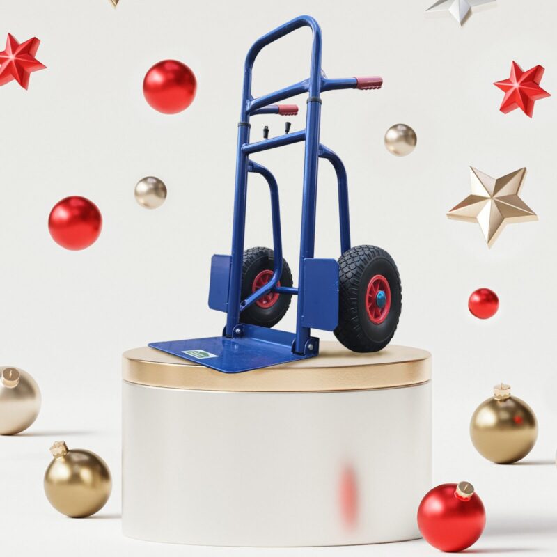 The Blue hand truck on a gold and silver plint surrounded by floating red and gold Christmas decorations. 