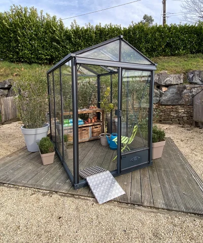 The Luxia Greenhouse filled with gardening equipment