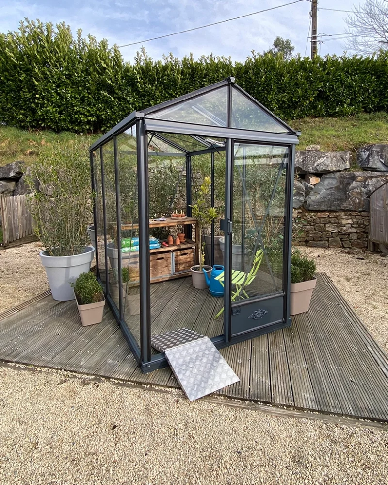 The Luxia Greenhouse filled with gardening equipment