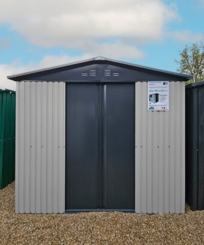 An exterior shot of the front of the white-and-grey mammoth shed