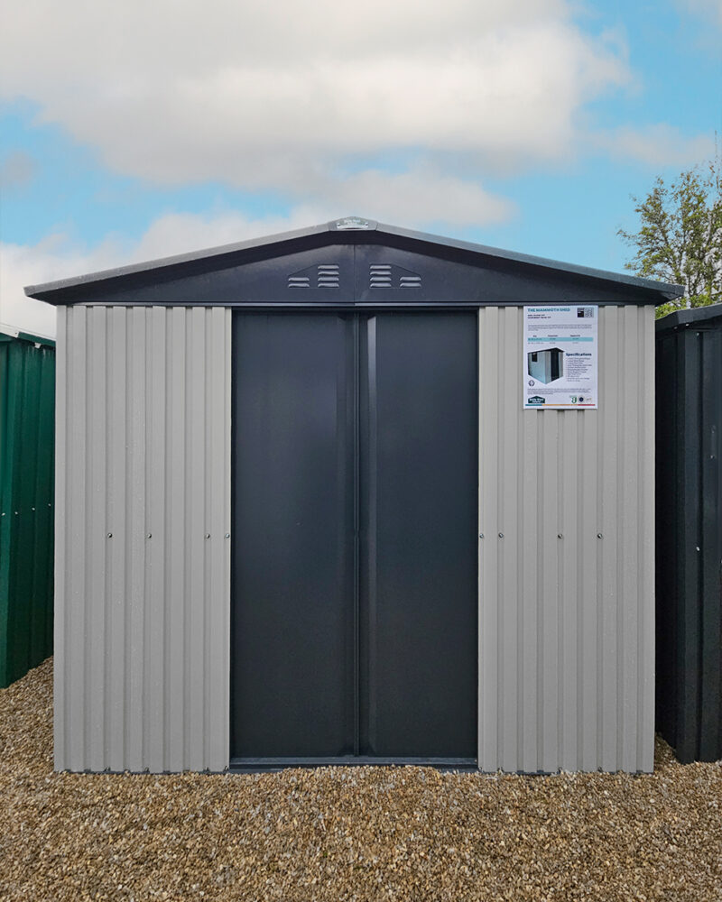 An exterior shot of the front of the white-and-grey mammoth shed