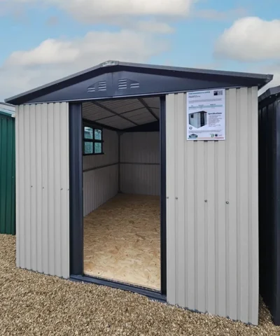 The Mammoth shed with the door open and the inside of the shed, including windows and ply flooring visible