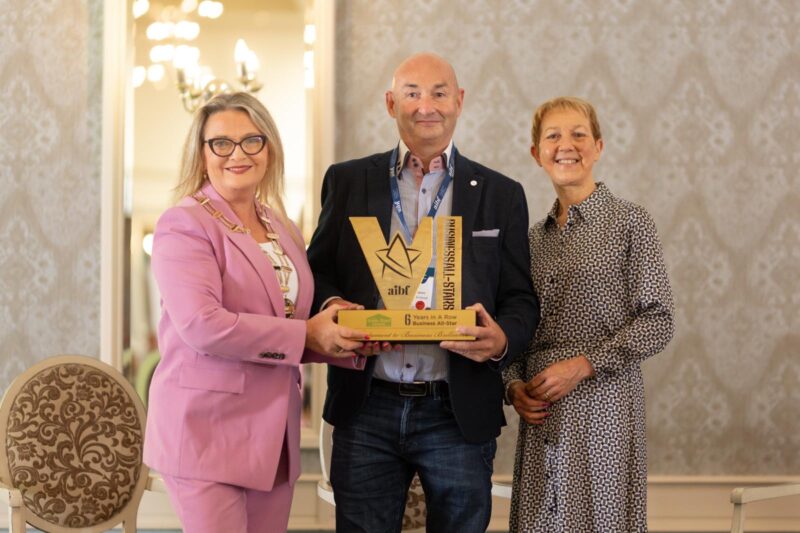 Alan receiving 6-years-in-a-row award