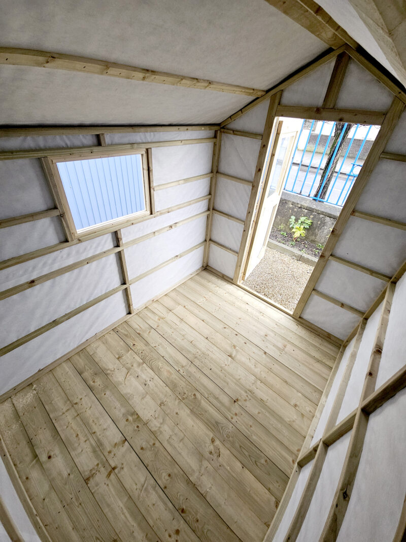 Interior of the shed as seen from the back wall