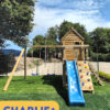 The Charlie+ playhouse with a blue slide
