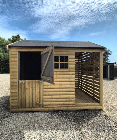 The front aspect of the logstore shed with half the door open