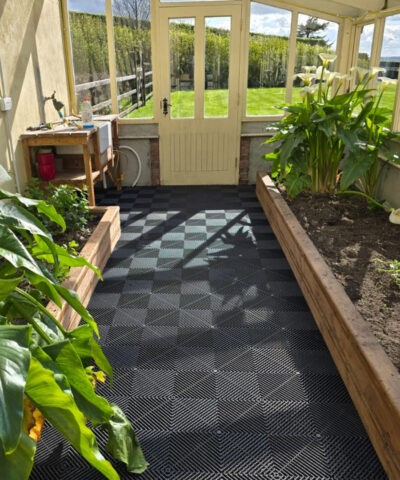 The a-grip tiles in use in a greenhouse