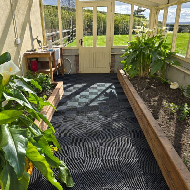 The a-grip tiles in use in a greenhouse