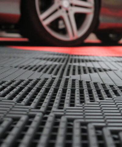 A car parked on top of the a-grip tiles