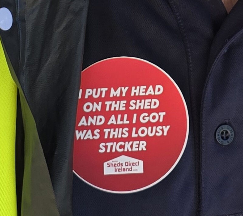 A sticker that reads 'I put my head on the shed and all I got was this lousy sticker'