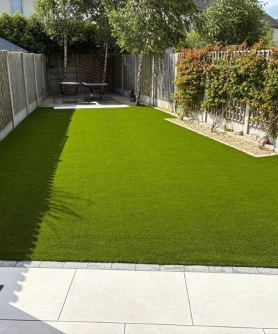 A garden completely filled with green artificial grass