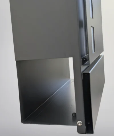 The newspaper holder on the postbox